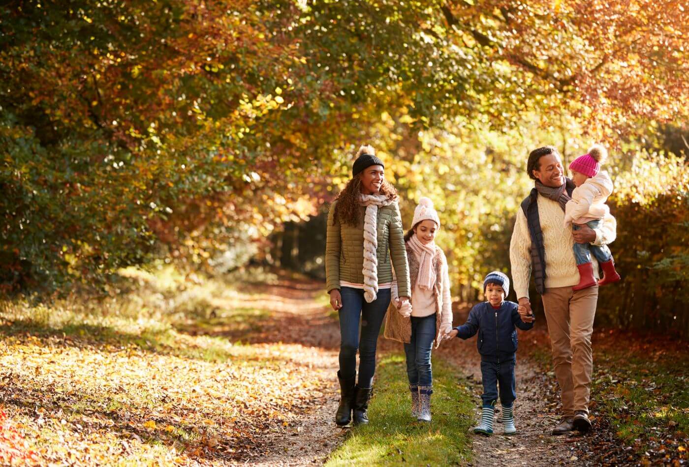 family walking in the woods in northumberland