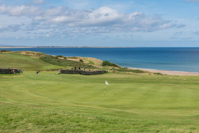 A view across Bamburgh Castle Golf Course to the coast beyond