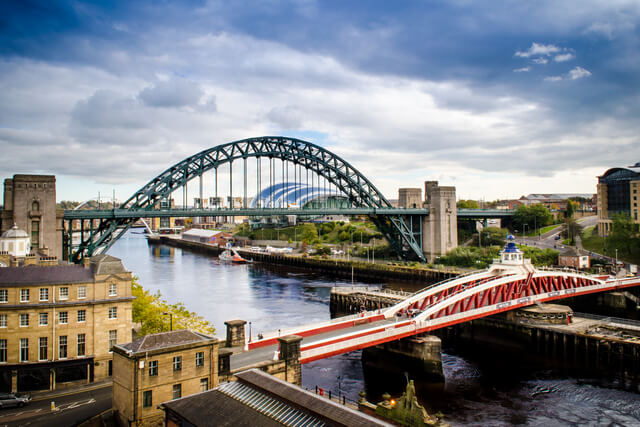 A view of the Tyne Bridge towering high above the River Tyne in Newcastle