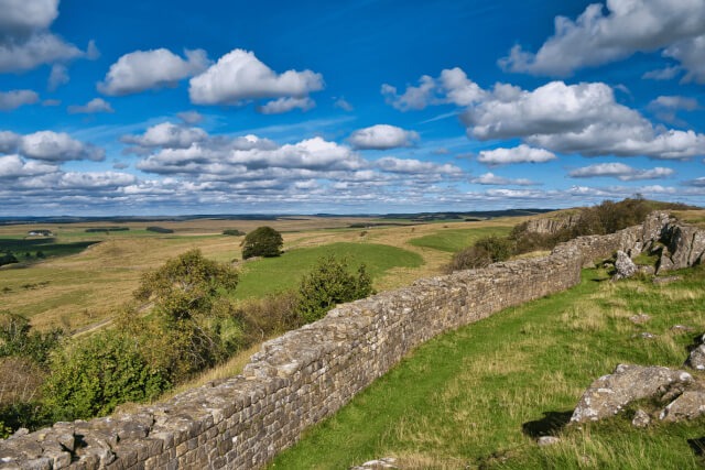 A stone wall and rolling hills in the Northumberland countryside